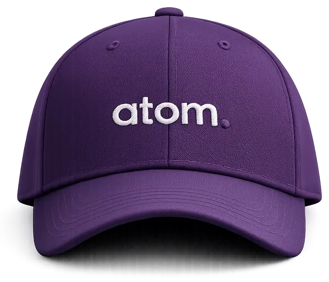 Фиолетовая кепка с белой объёмной вышивкой логотипа, работа ATOM LAB.